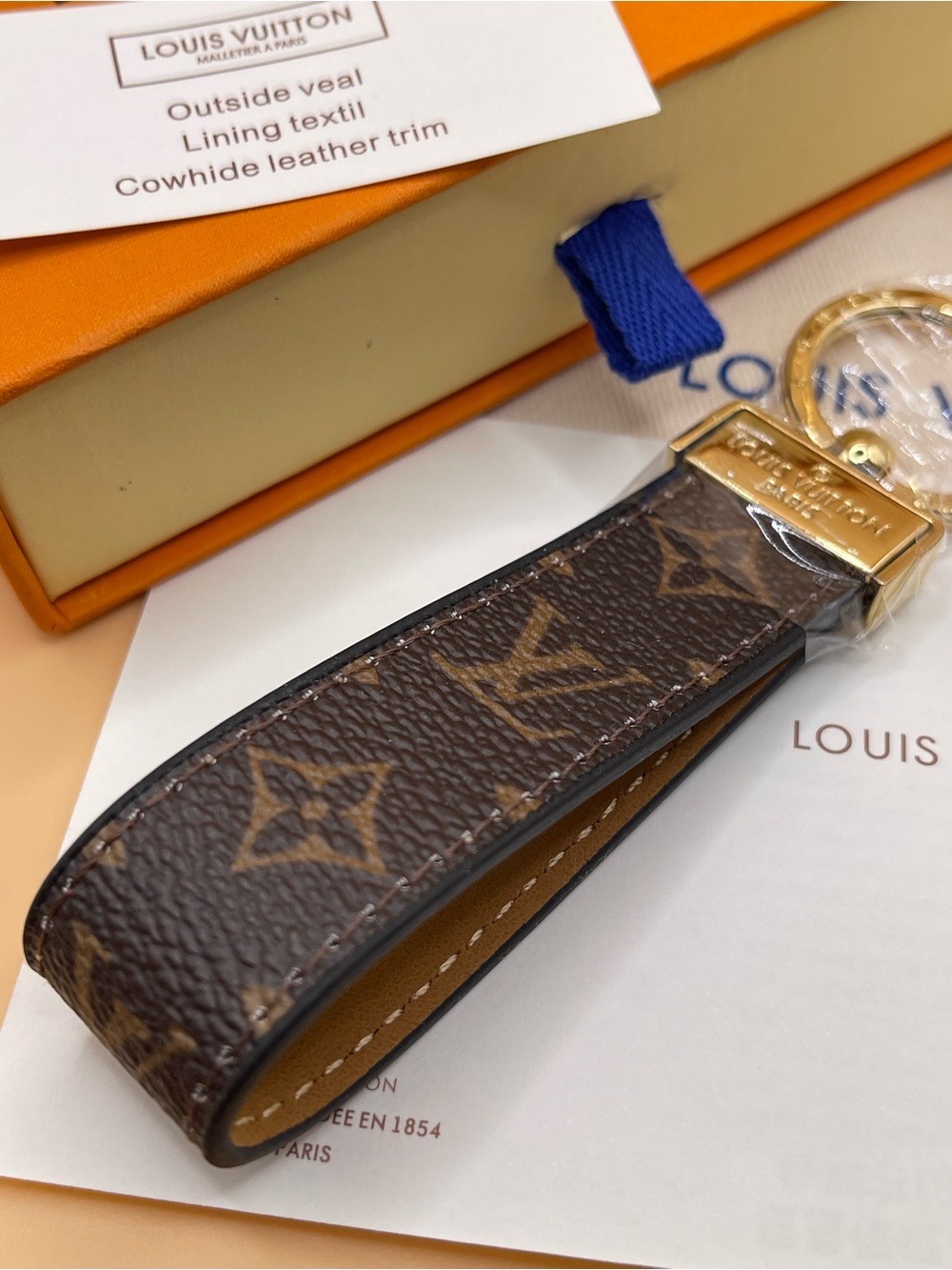 Louis Vuitton brown  Monogram Key Charm Includes Box and dust bag.